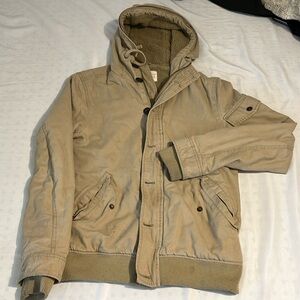 A vintage coat with a wooly inside.